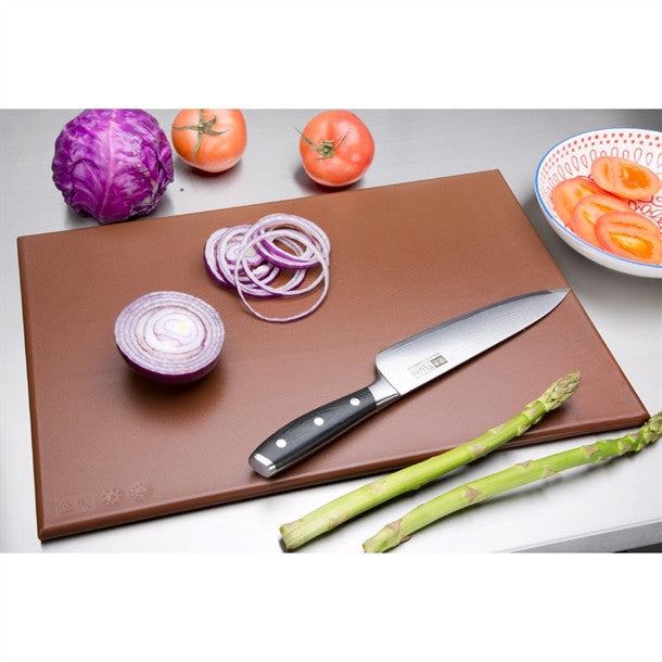 High density Chopping Board Brown colour with knife and chopped onions and other spices.