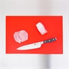 Full shot of High Density Chopping Board Red Colour with knife and slice spices.