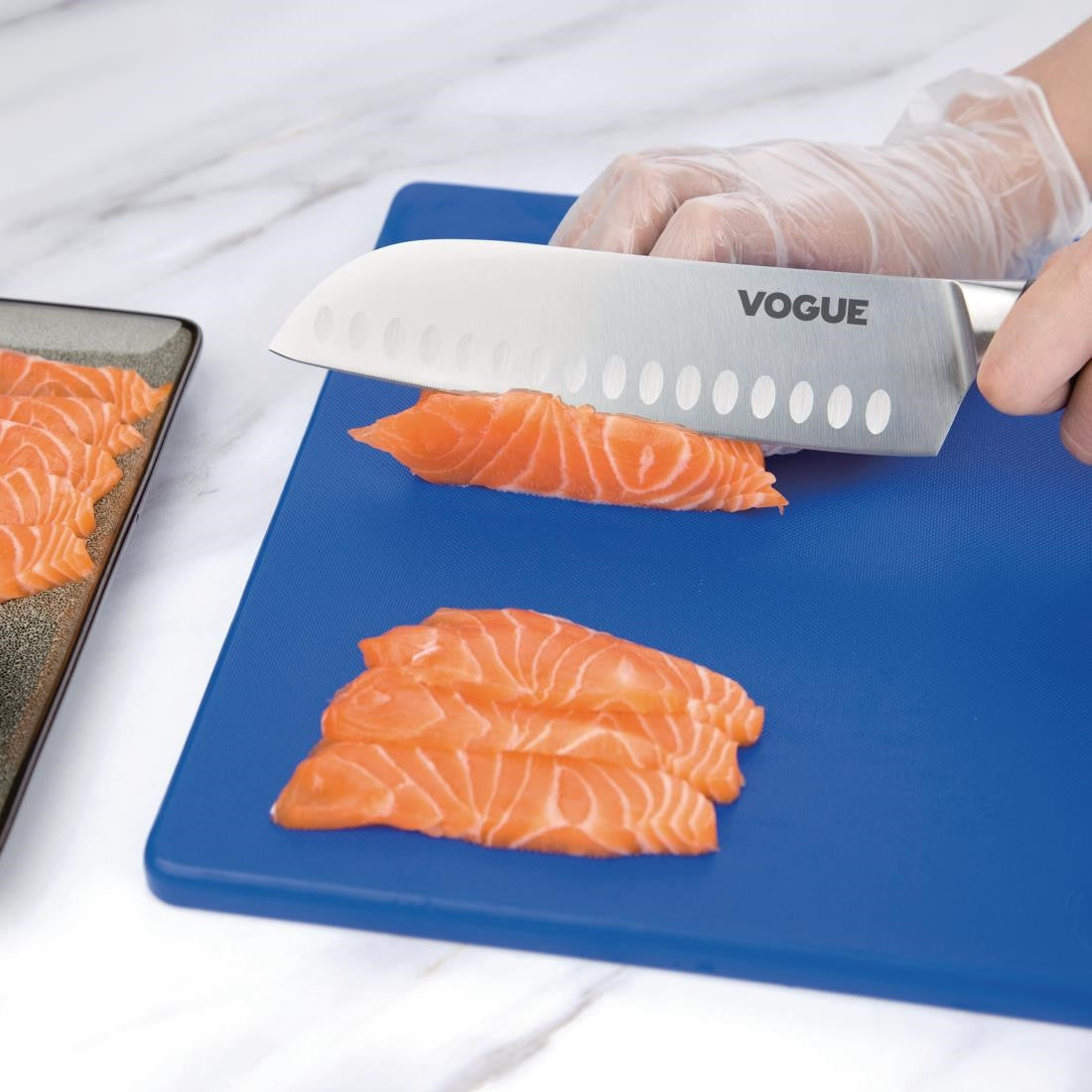 Vogue Soft Grip Santoku Knife 18cm used to cut meat.