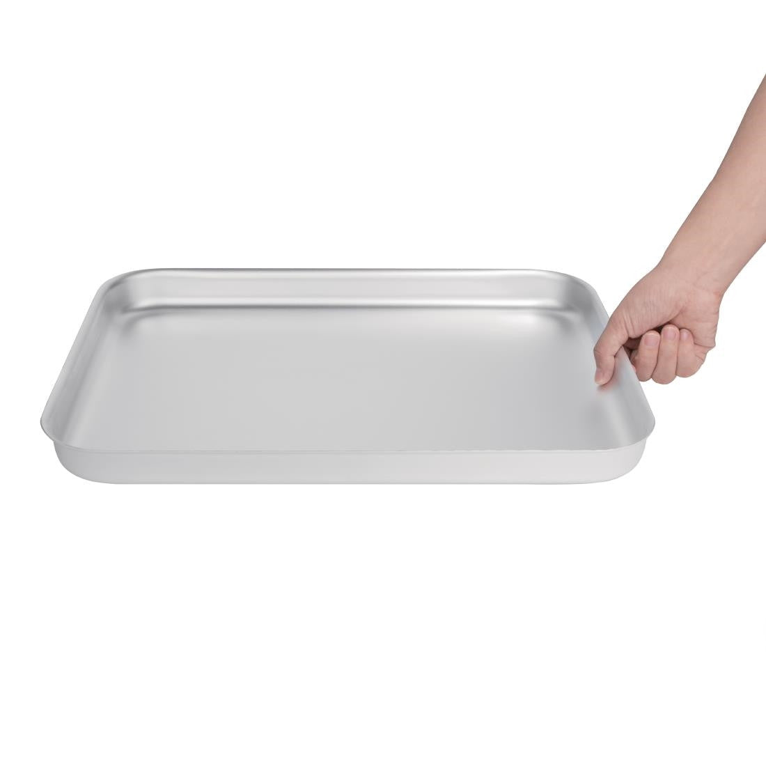 Vogue Aluminium Bakewell Pan 420mm in hand.
