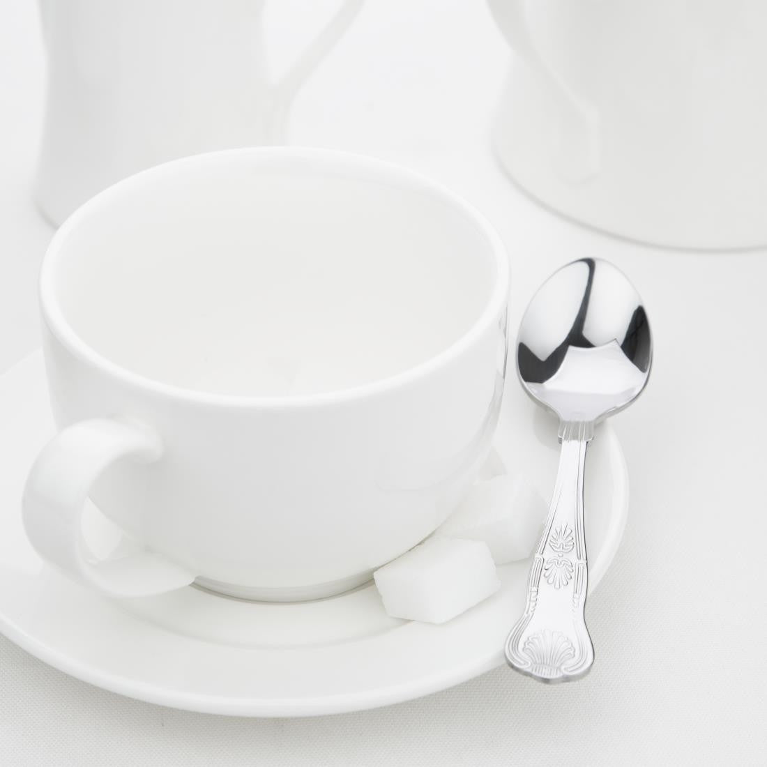 Cup and saucer with Olympia Kings Teaspoon placed on the side.