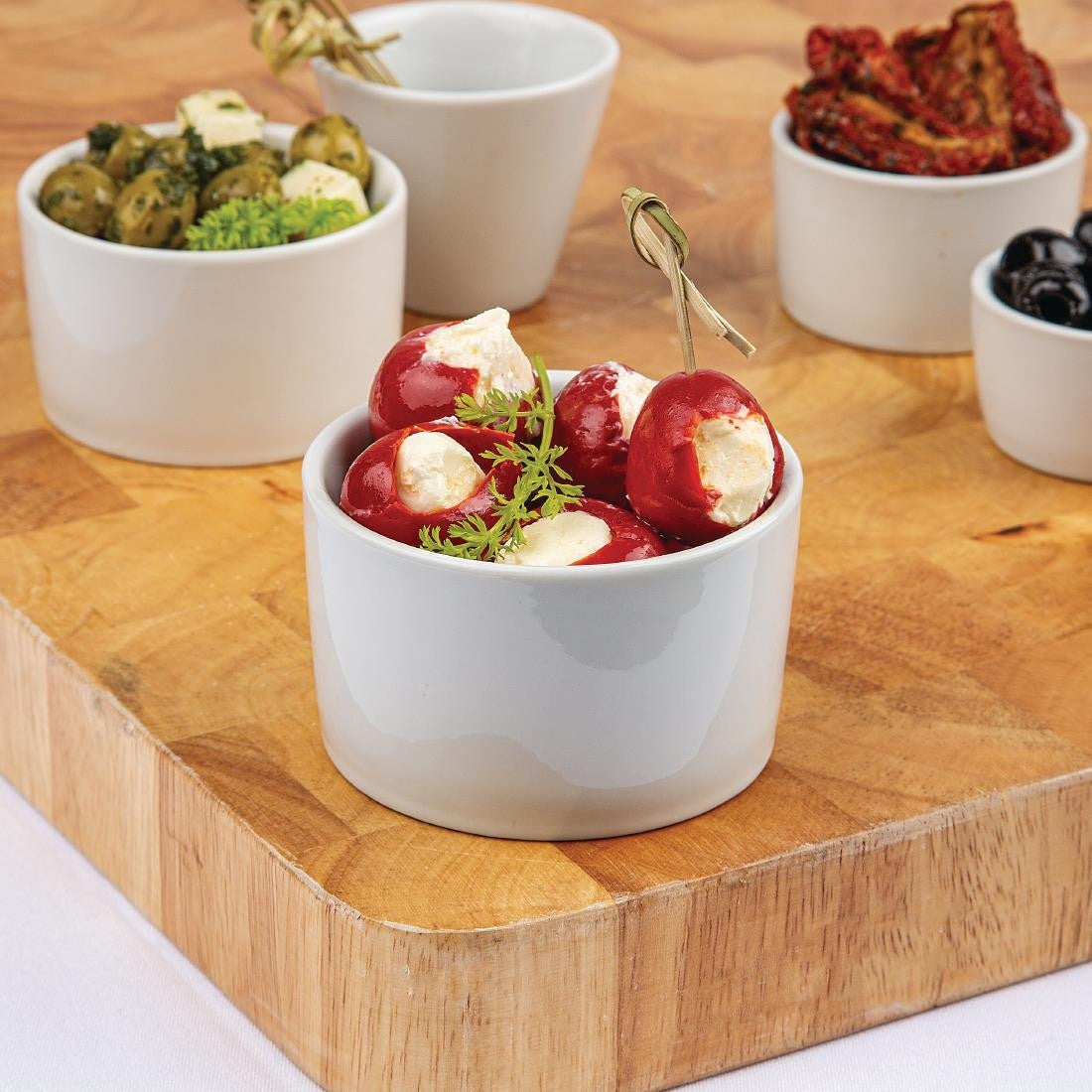 Olympia Whiteware Contemporary Ramekins 90mm with content along with other ramekins.