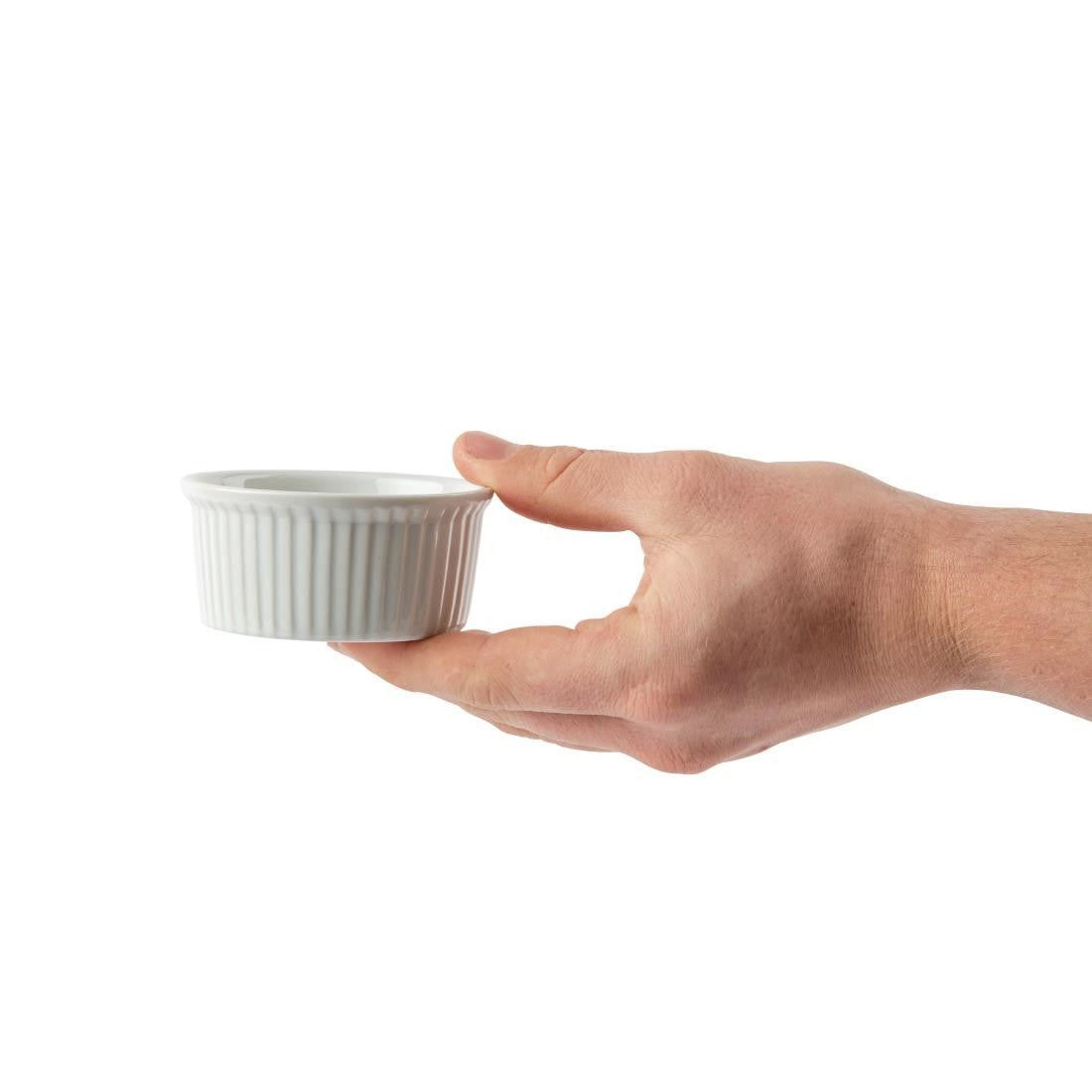 Hand holding Olympia Whiteware Ramekins 85mm.