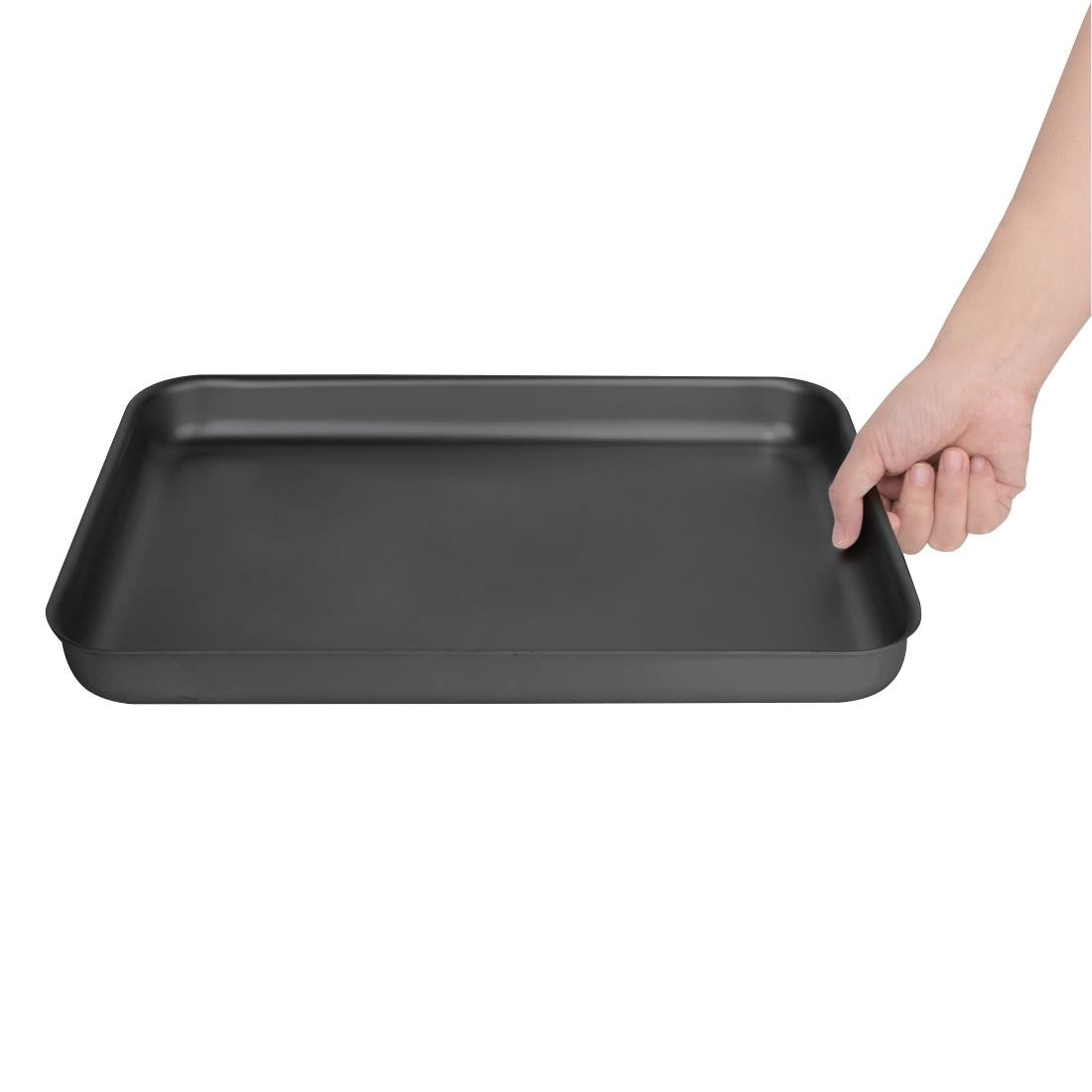 Vogue Anodised Aluminium Bakewell Pan 370mm in hand.