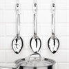 Full shot of 3 pcs Essentials Perforated Spoon 11 inch hanging on the wall.