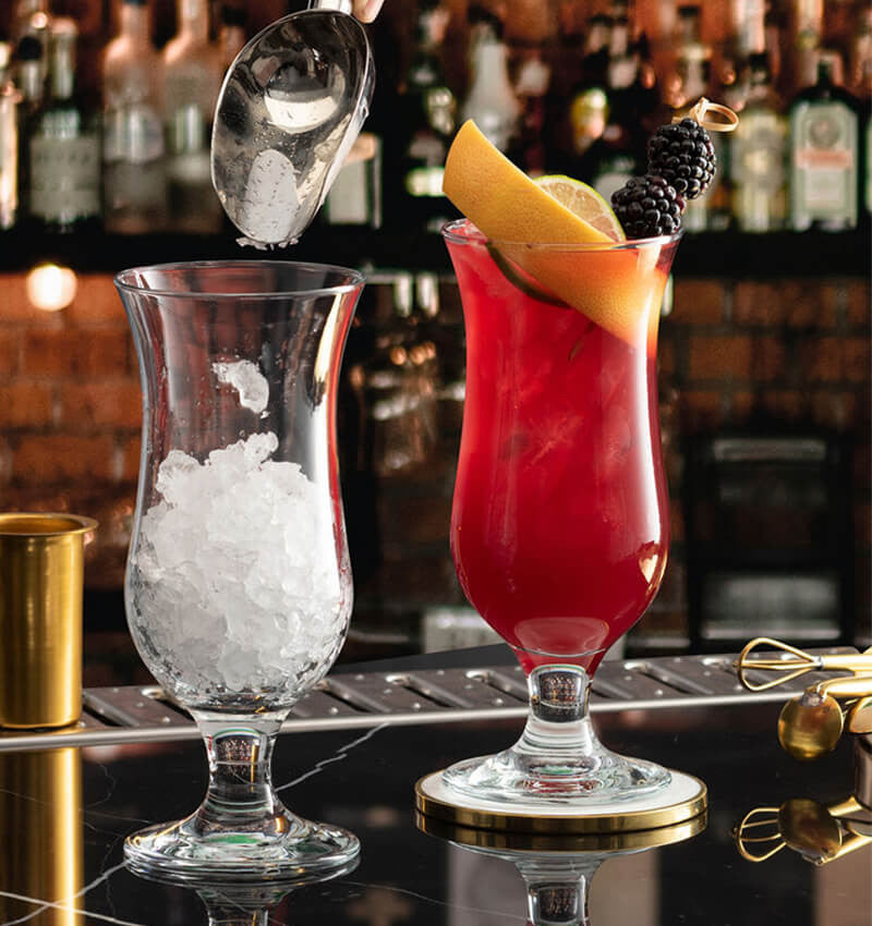 Full shot of two Hurricane Cocktail Glass 14.75 oz with content