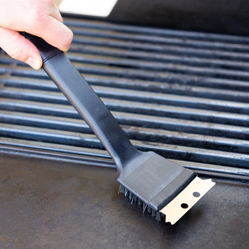 Full shot of Grill Brush with Scraper use in a griller.