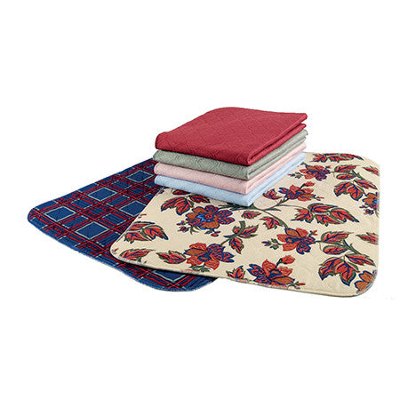 Two Seat Pads layed out on floor and Four folded seat pads layed on top