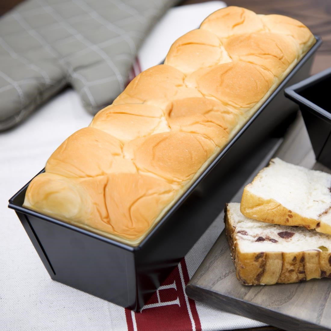 Vogue Non-Stick Loaf Tin 300mm with loaf of bread.