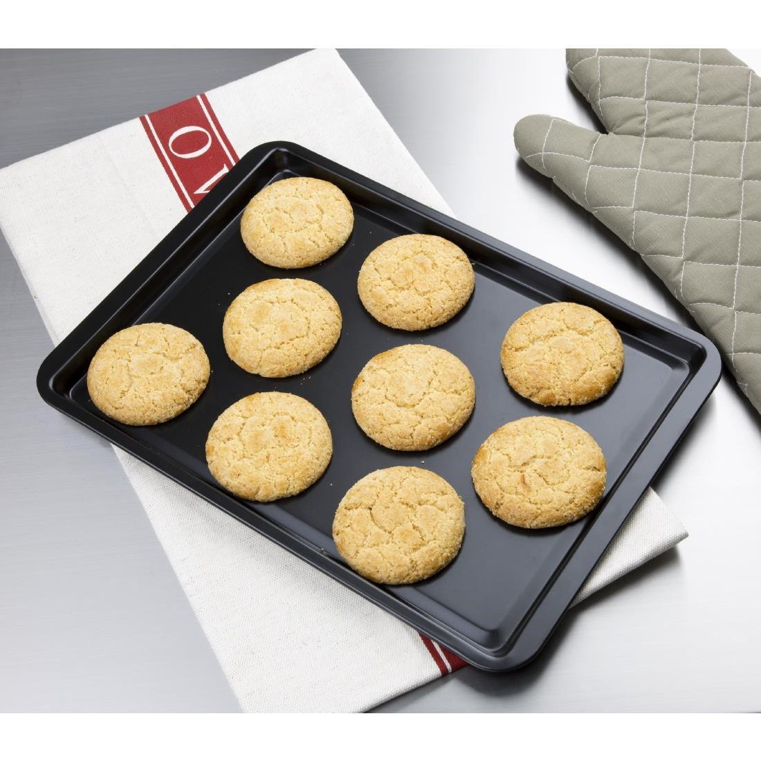 Vogue Non-Stick Carbon Steel Baking Tray 370 x 257mm with baked cookies.