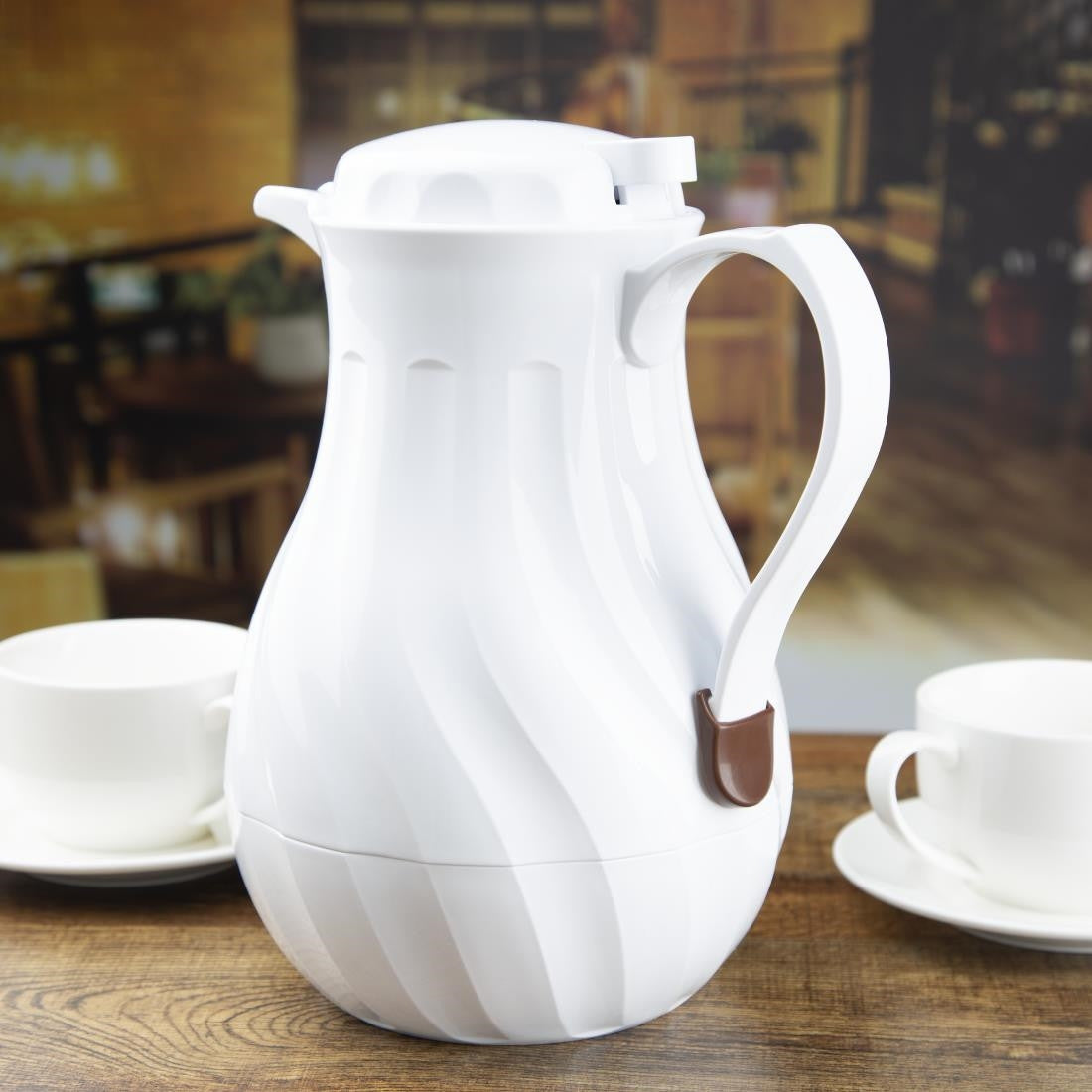 Olympia Insulated Swirl Jug White 2Ltr table set up.
