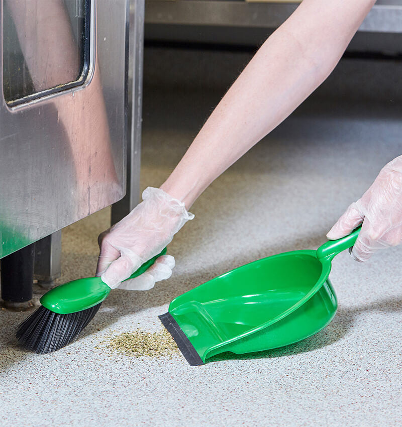 Green Dustpan and Brush in action