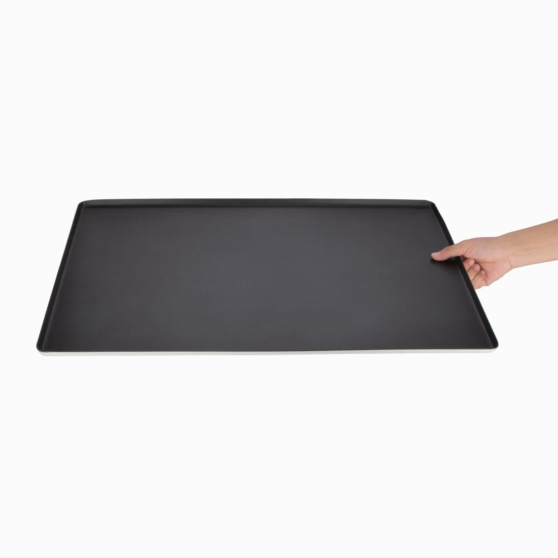 Vogue Non Stick Patisserie Tray in hand.