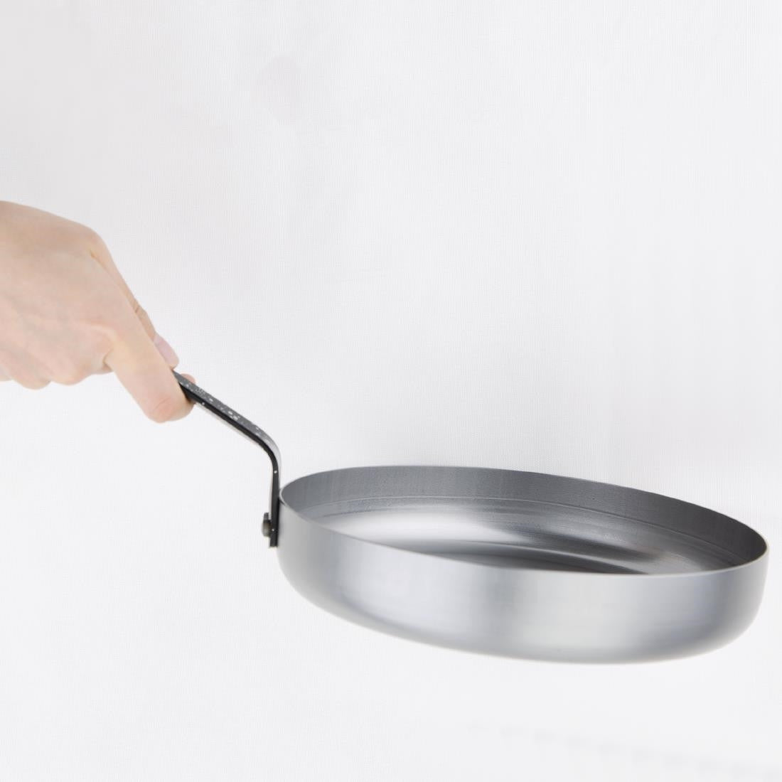 Vogue Carbon Steel Omelette Pan 200mm in hand.