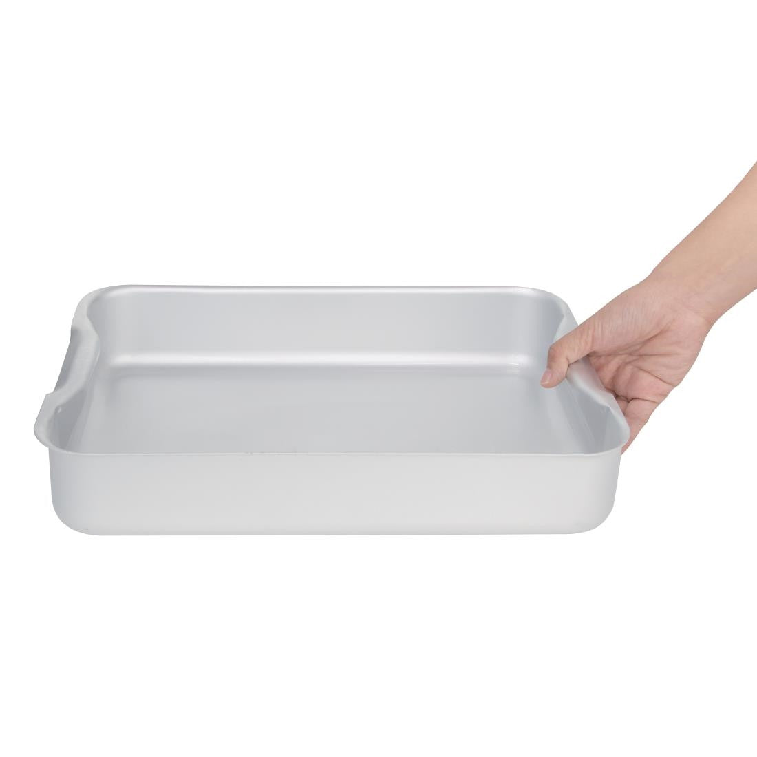 Hand holding Vogue Aluminium Roasting Dish 370mm.