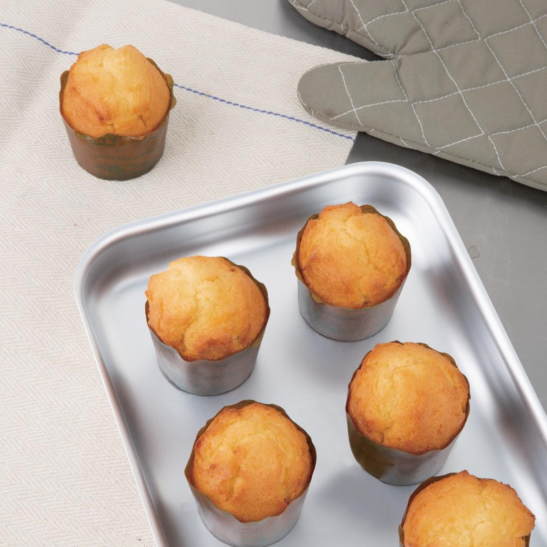 Vogue Aluminium Bakewell Pan 320mm with baked muffins.