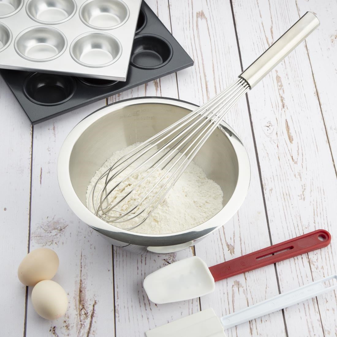 Vogue Heavy Whisk 16" with other baking materials.