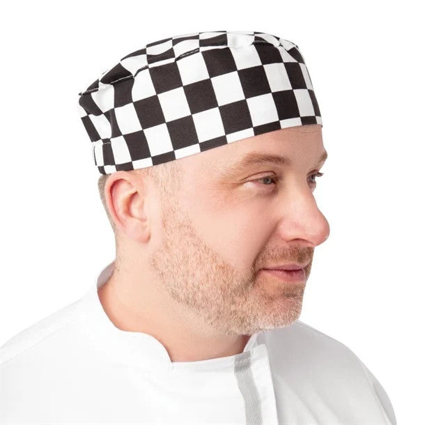 Chef wearing Whites Chefs Skull Cap Big Black and White Check
