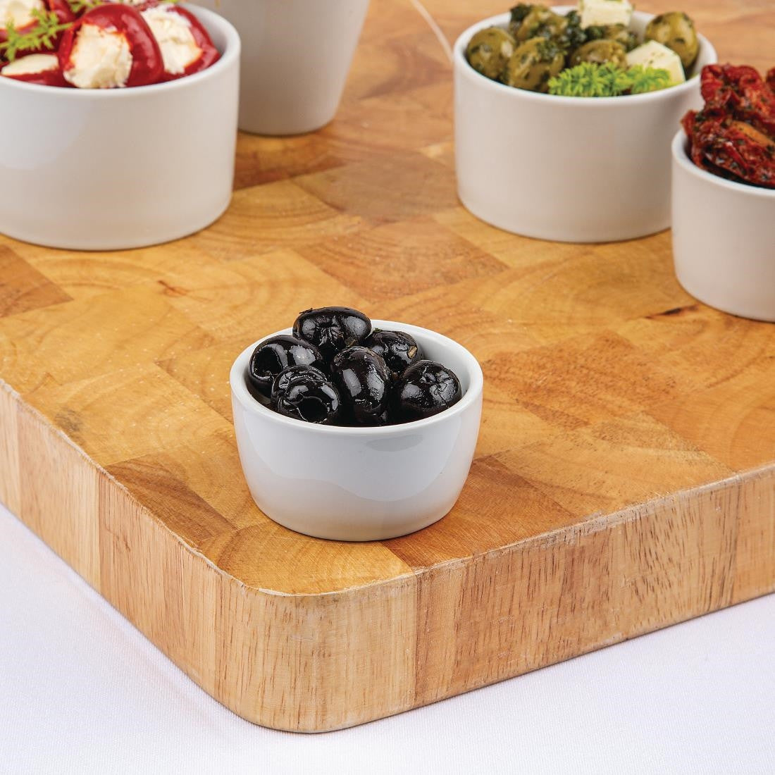 Olympia Whiteware Butter Dish 62mm with content along with other size of Butter Dish.
