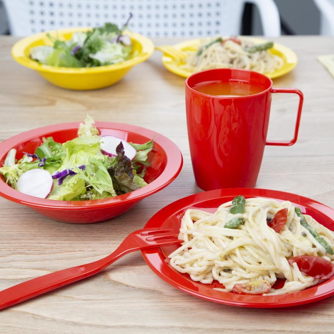 Olympia Kristallon Polycarbonate Bowls Red 172mm with other polycarbonate items with content.