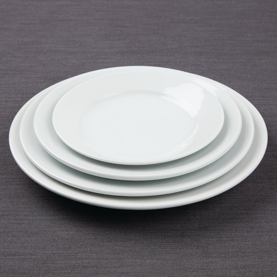 Olympia Athena Wide Rimmed Plates 228mm White stacked together with other plates.