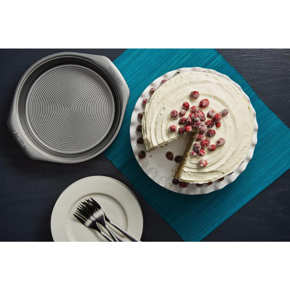 Circulon Springform Cake Tin 245mm with cake, forks, and plates.