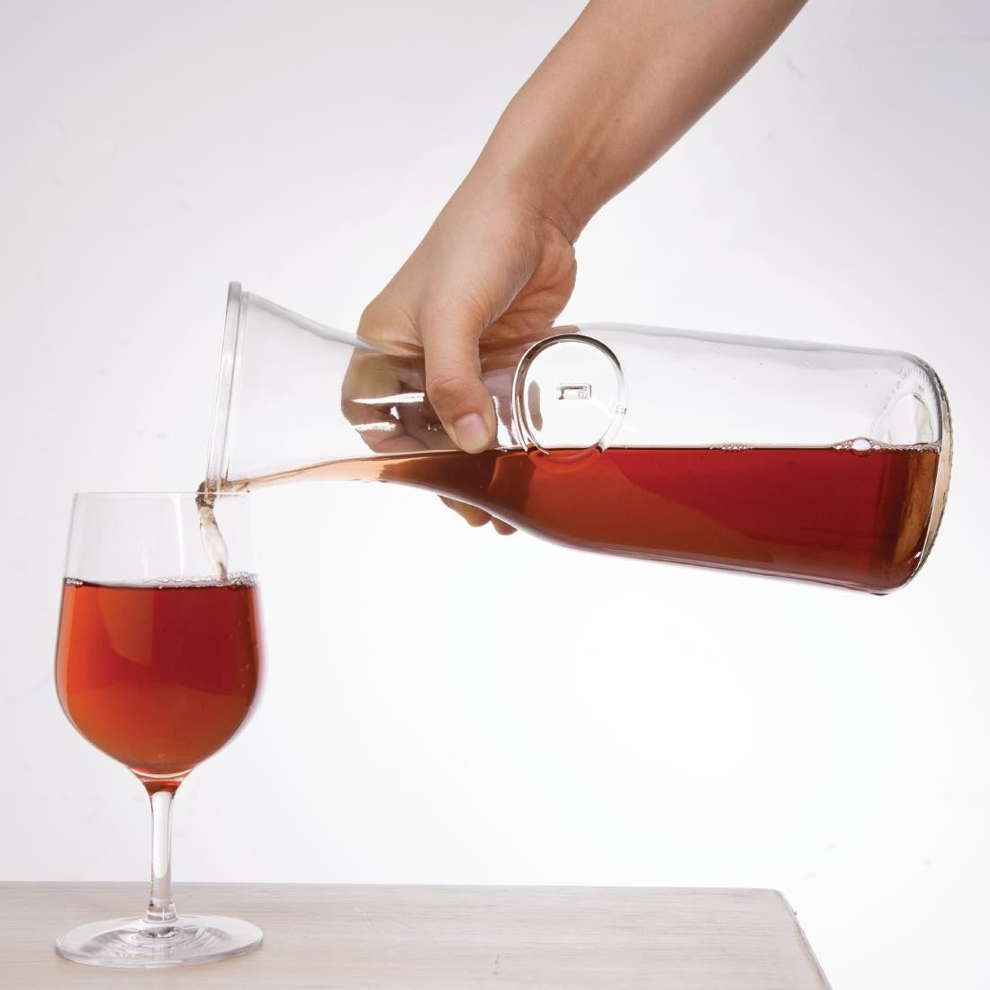 Olympia Glass Carafe 1Ltr with content poured to wine glass.