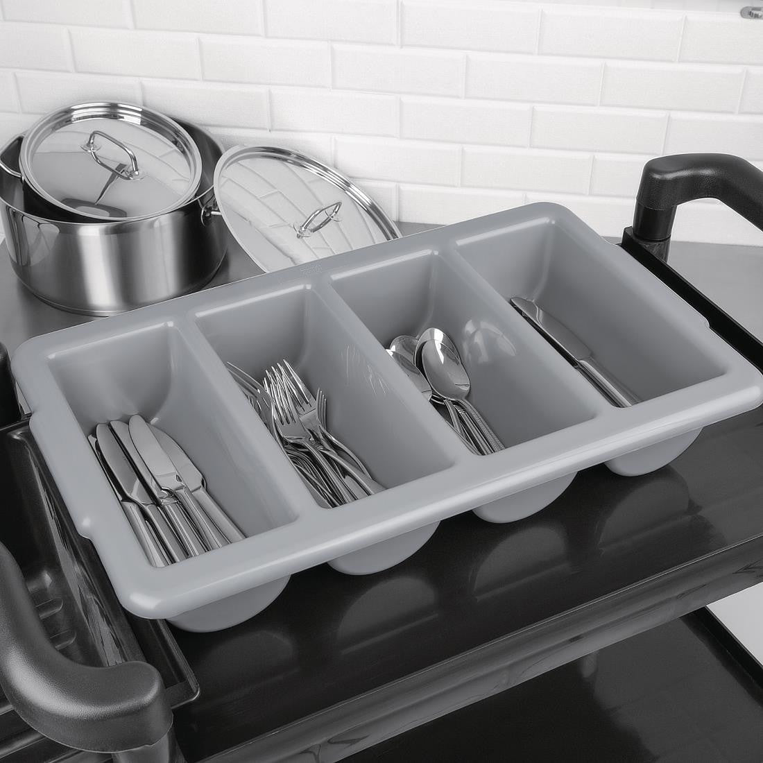 Olympia Kristallon Stackable Plastic Cutlery Tray Large with cutlery placed on.