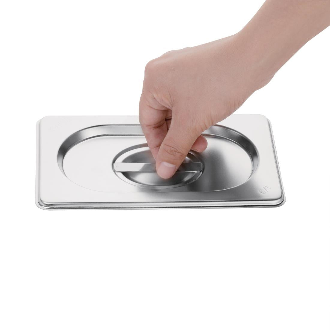 Hand holding Vogue Stainless Steel 1/4 Gastronorm Lid.
