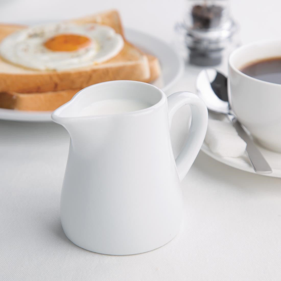 Olympia Whiteware Cream and Milk Jugs 170ml 6oz on table set up.